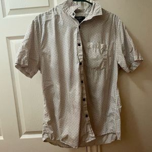 This is a forever 21 white and black pock-a-dot button up shirt